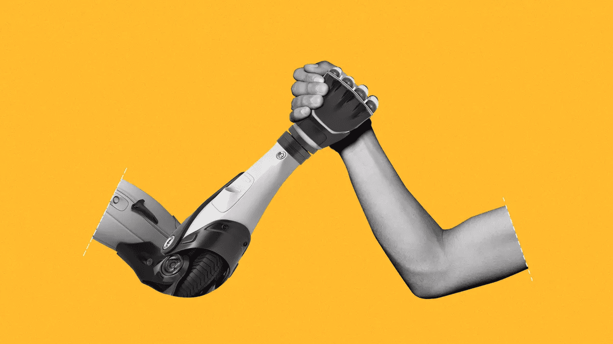 A robot arm and a human arm, hand-in-hand