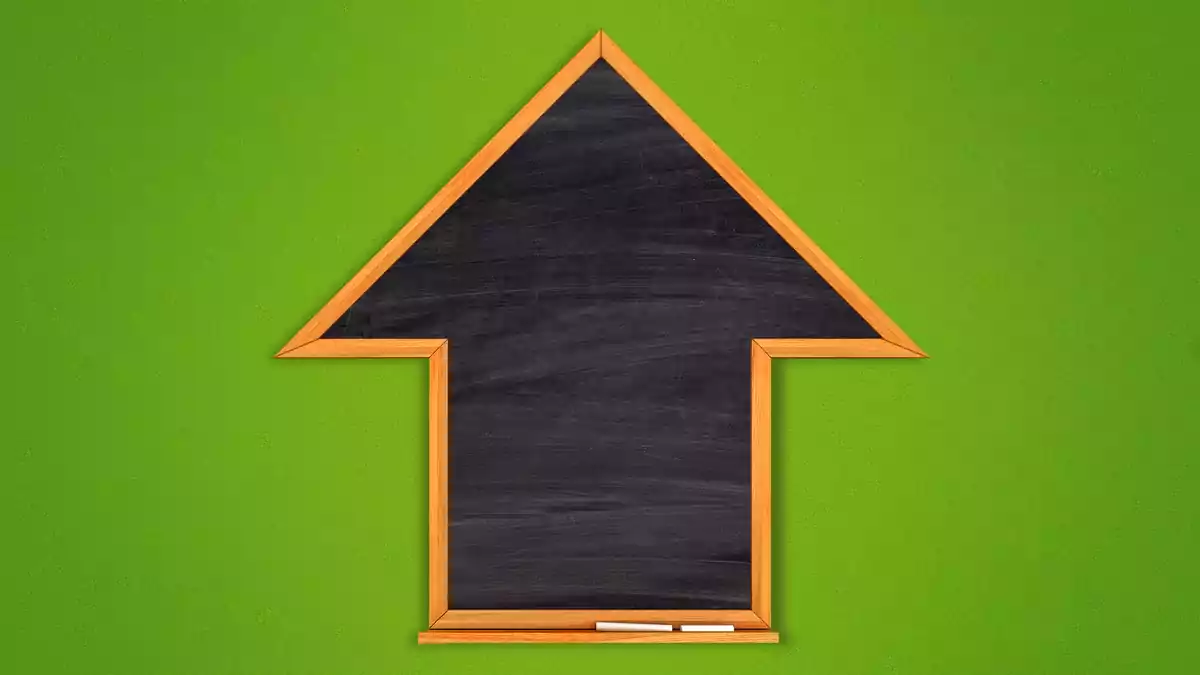 Chalkboard in the shape of an arrow pointing up