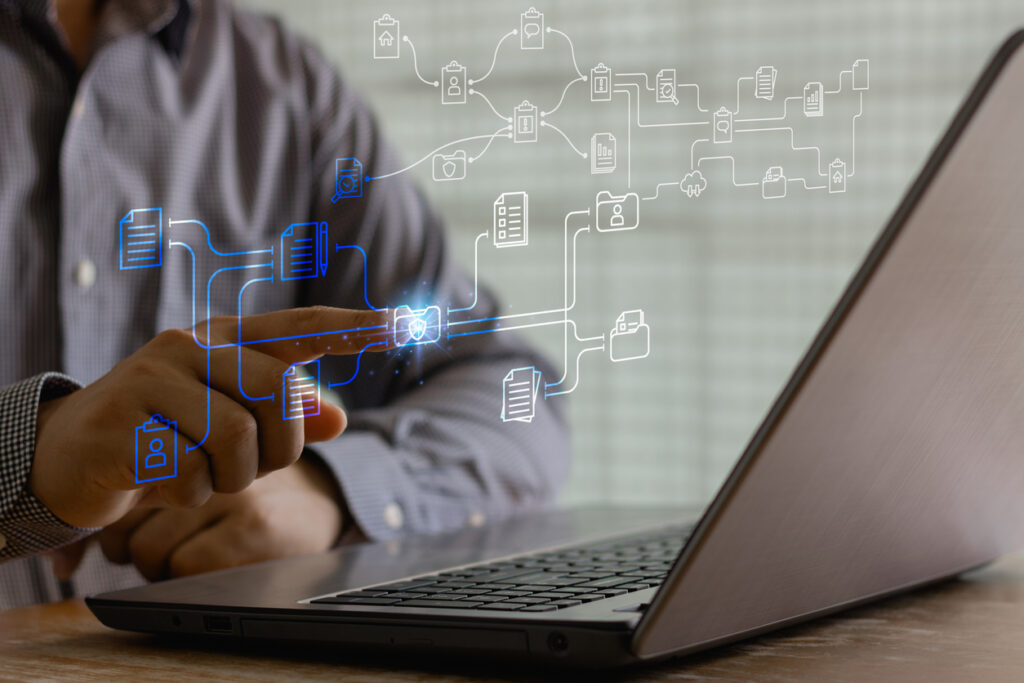 A man sitting at a laptop