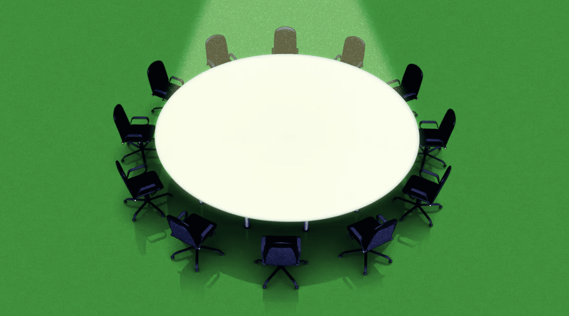 A round office table with empty chairs around it