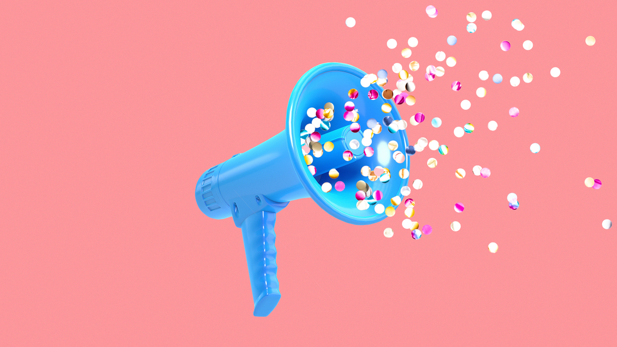 Confetti blowing out of a pink megaphone